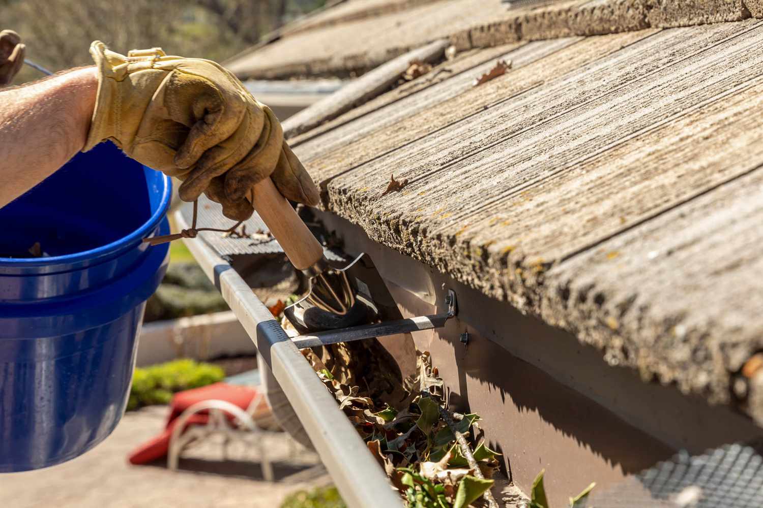 clean-gutters-and-downspouts-1824714-01-d167dfb6d3494a95bcb20ee7a94f6cf9